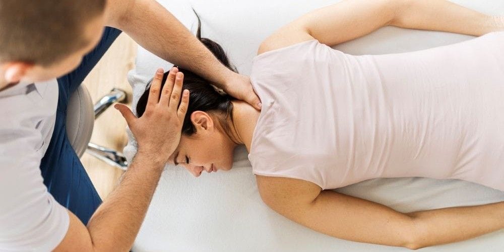 Chiropractor making an adjustment.